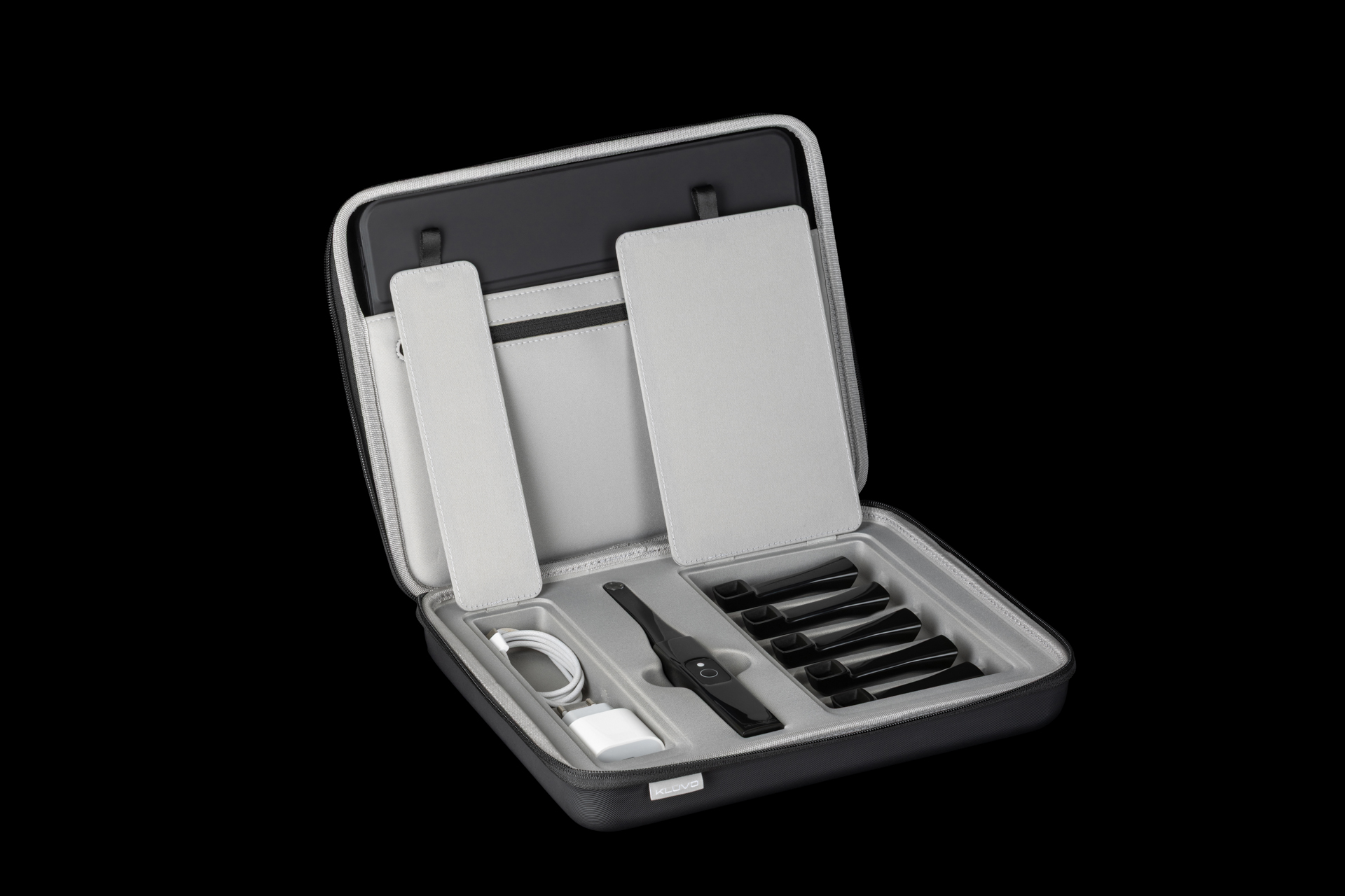 Klüvo’s carrying case open, holding the camera, its attachments, and a tablet